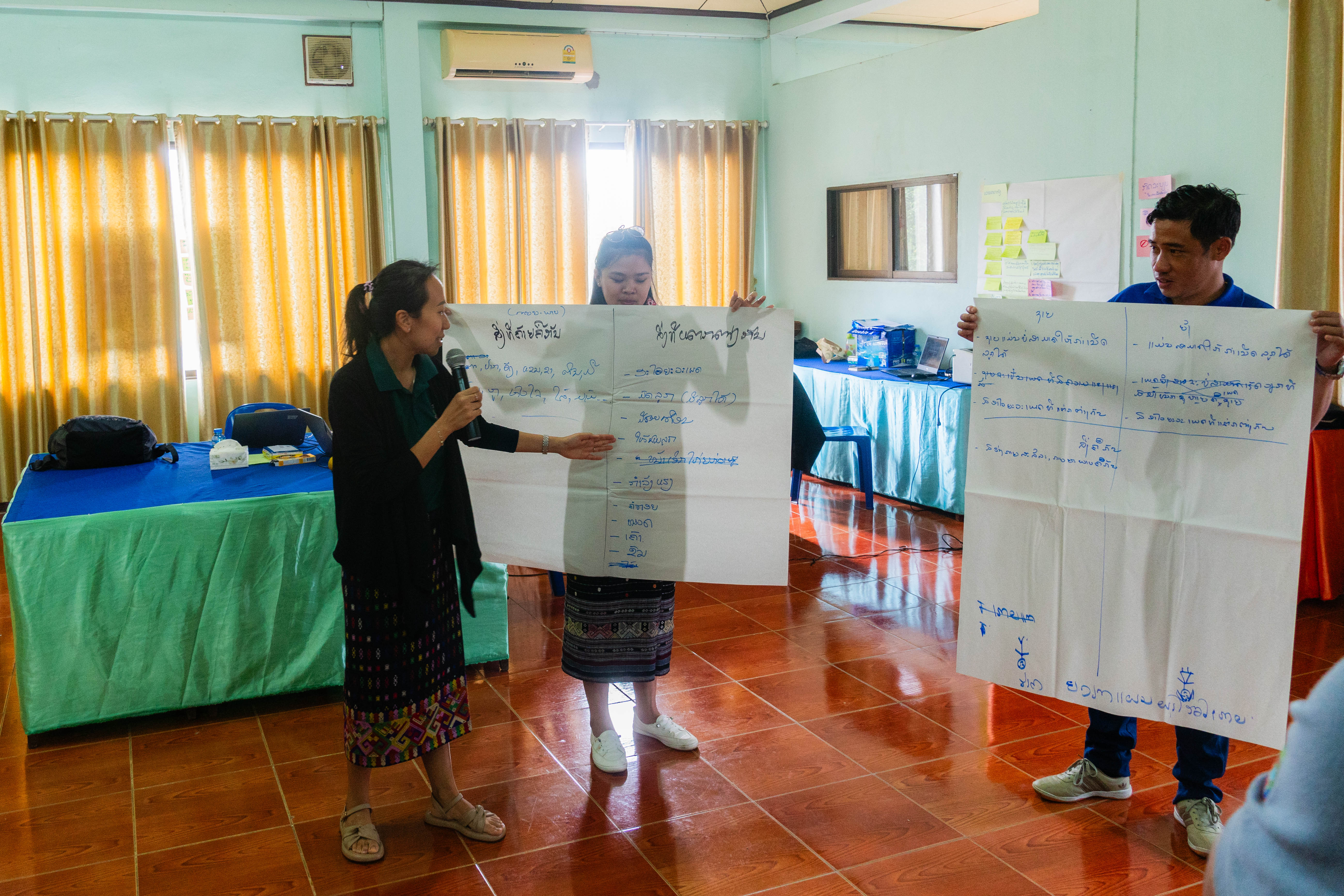RECOFTC Lao PDR's training officer, Souphaline Soulyavong, summarizes the group discussion that compared the roles of men and women in forest fire management