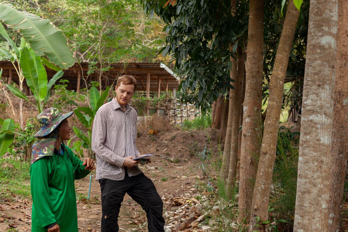 Pom shows the author her forest garden in Phetchaburi Province, Thailand 