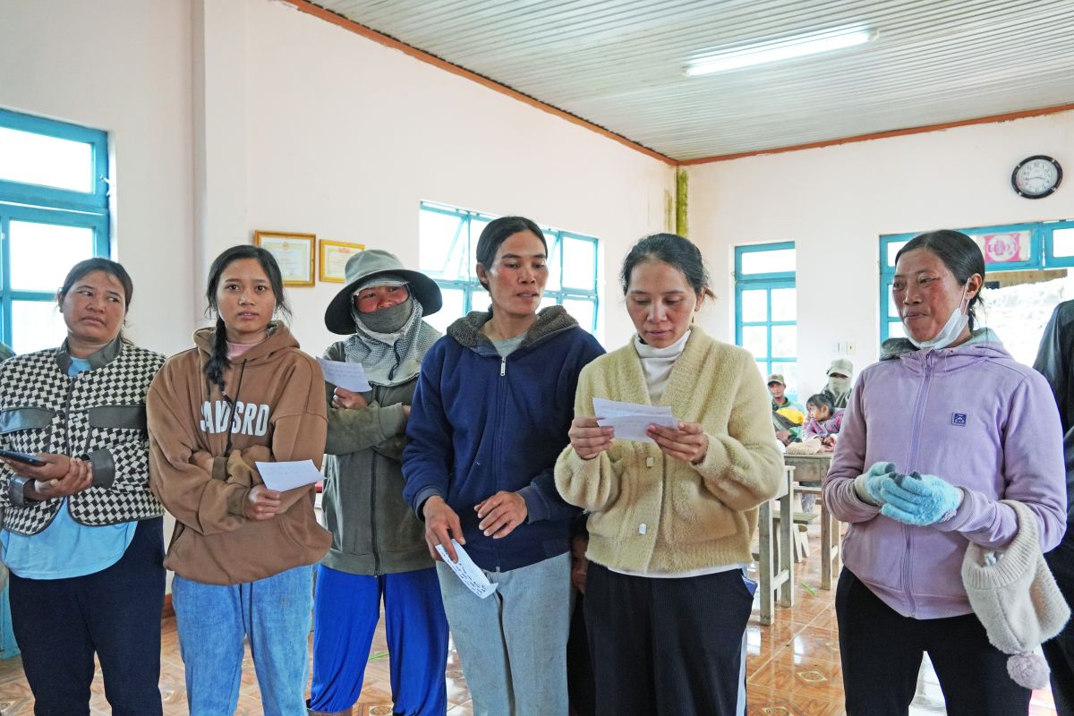Women in Tan Ha village are taking leadership roles in their team. The group pictured here is discussing the participation of women and men in forest fire management.