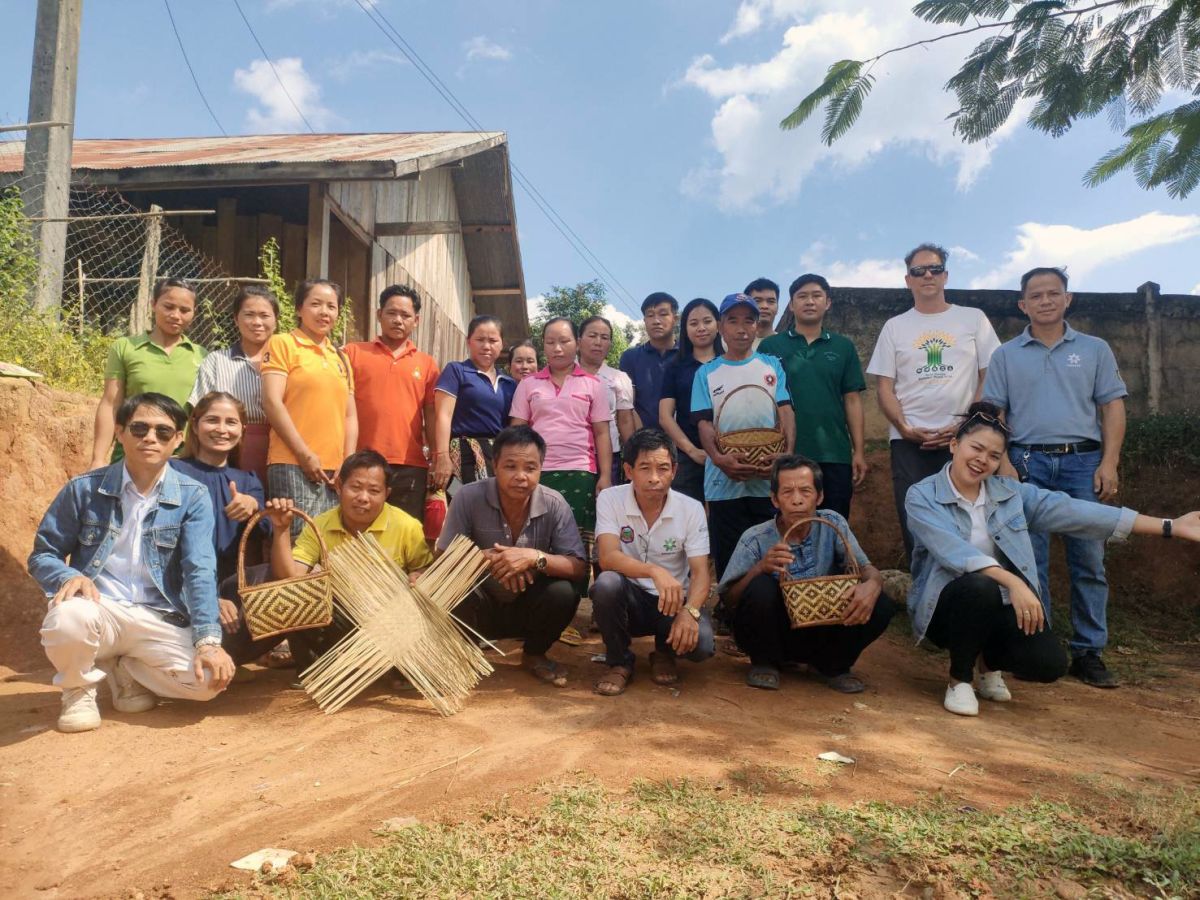 A group photo comprising RECOFTC main office and RECOFTC Lao PDR colleagues with community-based enterprise group members in Houythong village, Lao PDR. Photo:RECOFTC 