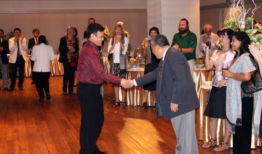 Dr. Malla and Dr. Thaung shake hands