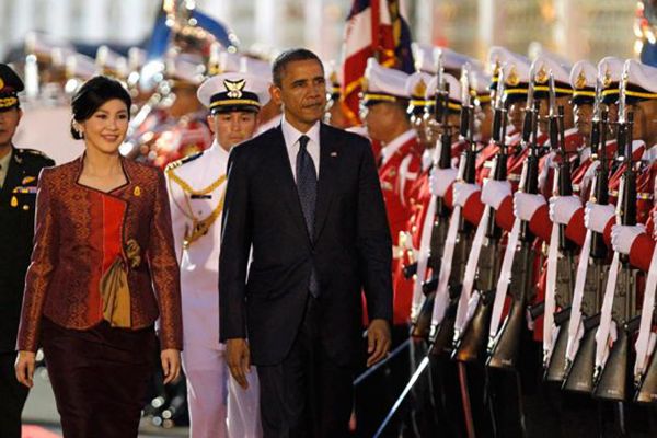 President Barack Obama walks with Prime Minister Yingluck Shinawatra.